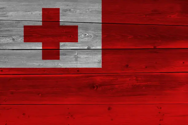 Photo of Tonga flag painted on old wood plank
