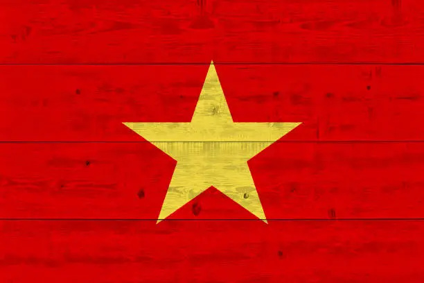 Photo of Vietnam flag painted on old wood plank