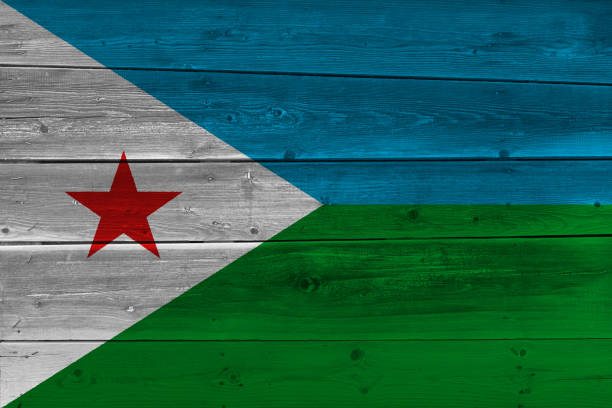 Djibouti flag painted on old wood plank Djibouti flag painted on old wood plank. Patriotic background. National flag of Djibouti flag of djibouti stock pictures, royalty-free photos & images