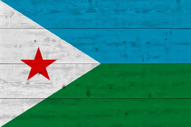 Photo of Djibouti flag painted on old wood plank