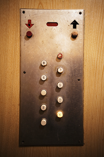 Details of an old elevator, close-up view on elevator buttons. 