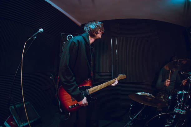 istock Guitarist playing in band 1136692557