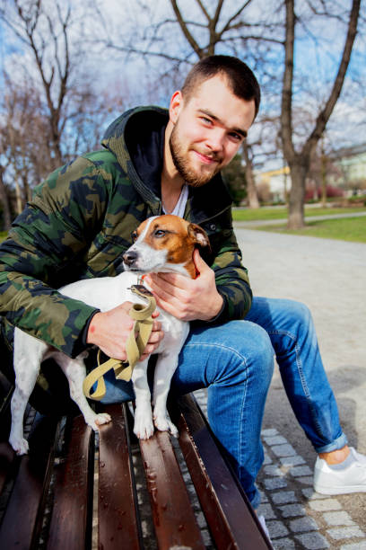 istock Young man with his dog, Jack Russell Terrier, 1136692692