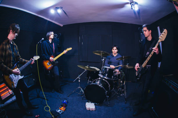 istock Rock and roll band performing hard rock music 1136692707
