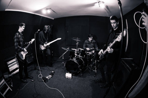 istock Rock and roll band performing hard rock music 1136692826