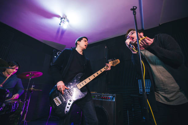 istock Singer and guitarist in band 1136692879