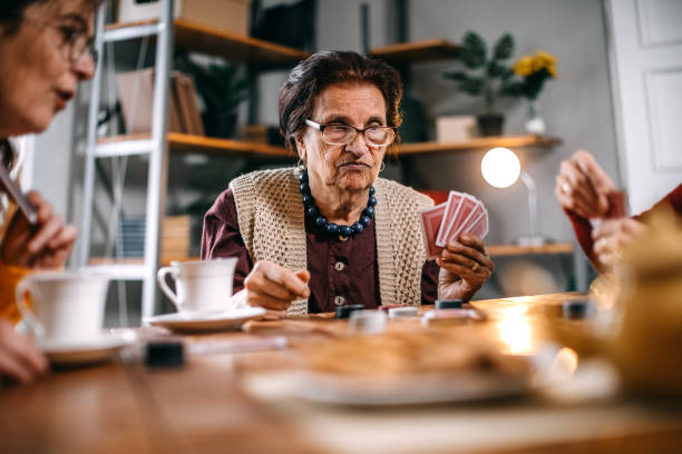 istock Active senior women playing games at home 1136693747
