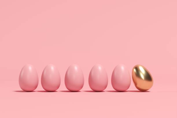 istock Outstanding Golden Egg among brown eggs on pink background. minimal Easter idea. 1136693862
