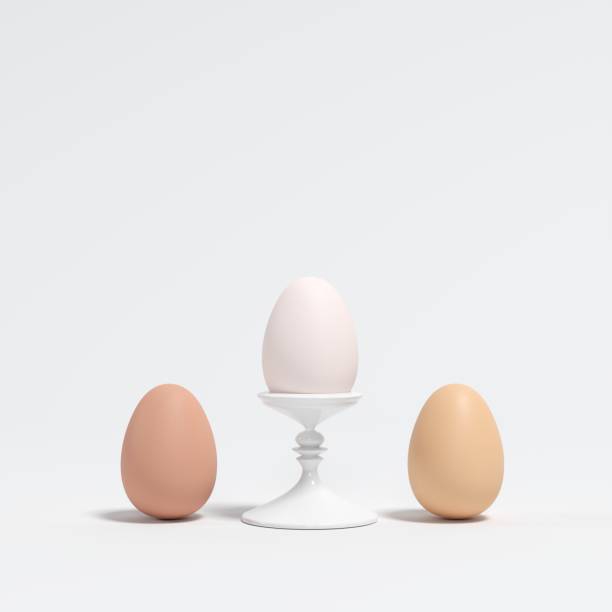 istock White Egg on white dish with brown eggs on white background. minimal idea concept. 1136693876