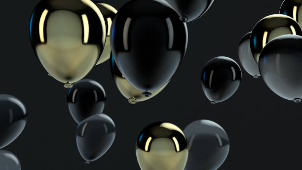 istock Gold and Black balloon floating in the air 1136694010