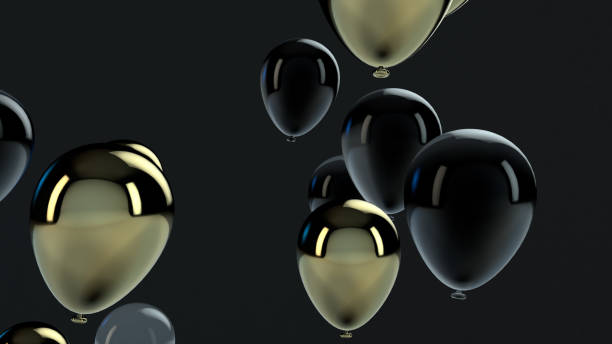 istock Gold and Black balloon floating in the air 1136694020