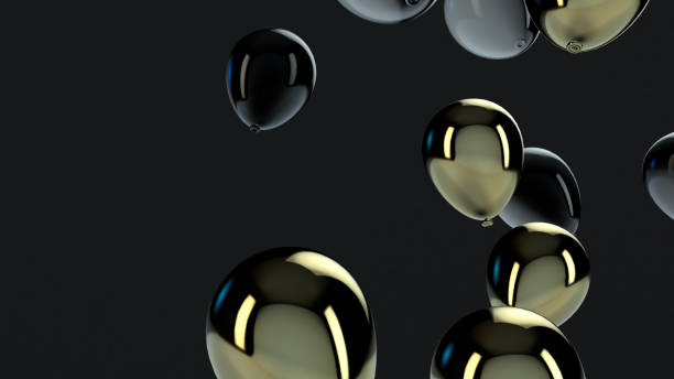 istock Gold and Black balloon floating in the air 1136694096