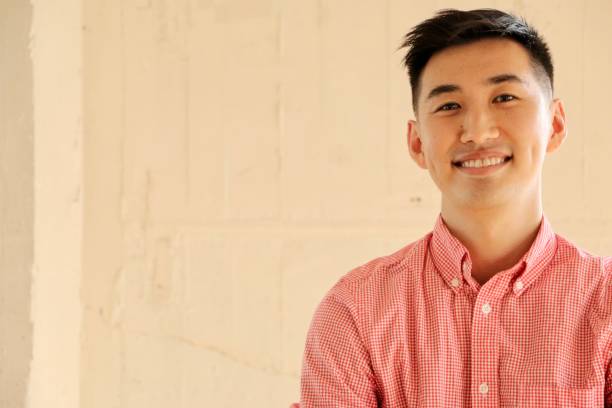 istock Smiling Young Japanese man 1136697509