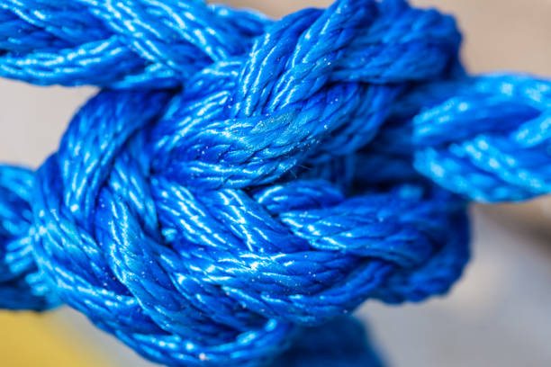 istock Blue sailing rope tied with knots 1136699602