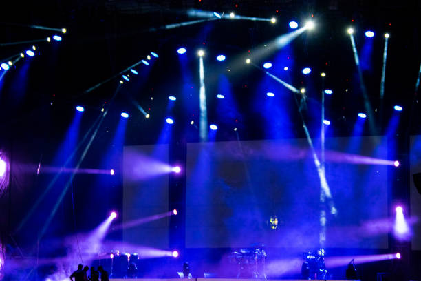 istock Lights on open air stage afternoon and evening, musical concert, powerful light visual impact color, visual technology in Latin America. 1136702851