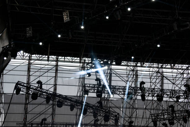 istock Lights on open air stage afternoon and evening, musical concert, powerful light visual impact color, visual technology in Latin America. 1136702923