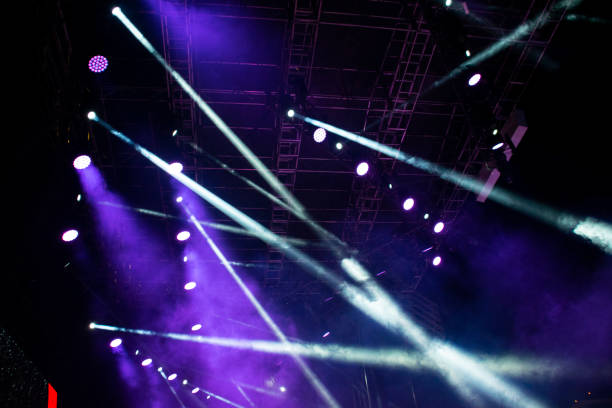 istock Lights on open air stage afternoon and evening, musical concert, powerful light visual impact color, visual technology in Latin America. 1136702928