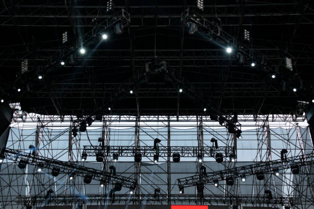 istock Lights on open air stage afternoon and evening, musical concert, powerful light visual impact color, visual technology in Latin America. 1136702934