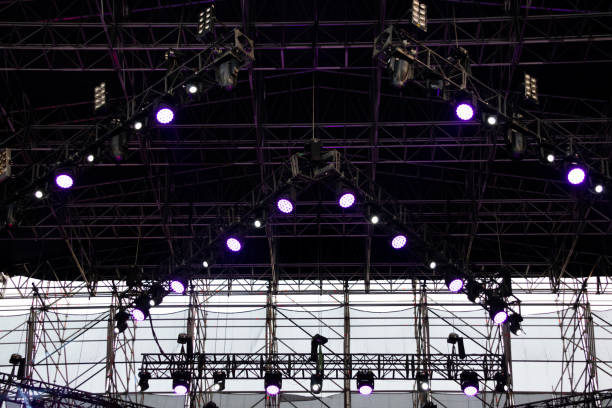 istock Lights on open air stage afternoon and evening, musical concert, powerful light visual impact color, visual technology in Latin America. 1136702941