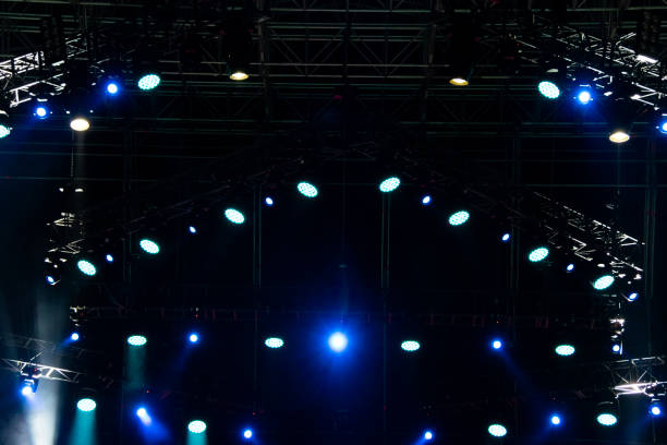 istock Lights on open air stage afternoon and evening, musical concert, powerful light visual impact color, visual technology in Latin America. 1136702967