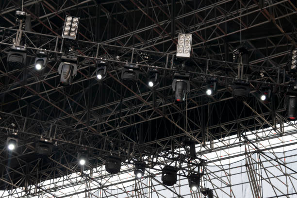 istock Lights on open air stage afternoon and evening, musical concert, powerful light visual impact color, visual technology in Latin America. 1136702971
