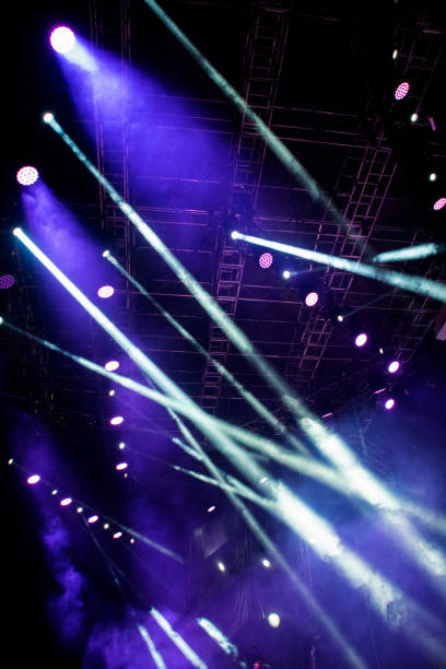 istock Lights on open air stage afternoon and evening, musical concert, powerful light visual impact color, visual technology in Latin America. 1136702973