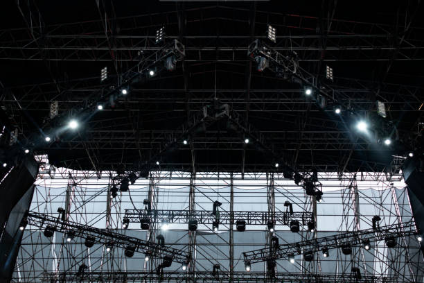 istock Lights on open air stage afternoon and evening, musical concert, powerful light visual impact color, visual technology in Latin America. 1136702989