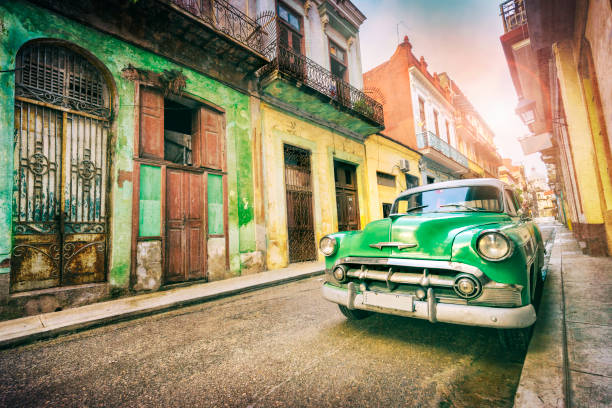istock Vintage green oldtimer car driving through Old Havana Cuba 1136703269