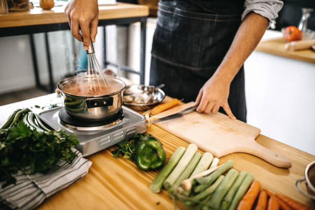 istock Man mixing food 1136706856