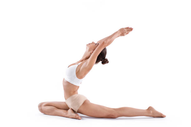 istock Beautiful woman practicing yoga pose on white background. 1136707742
