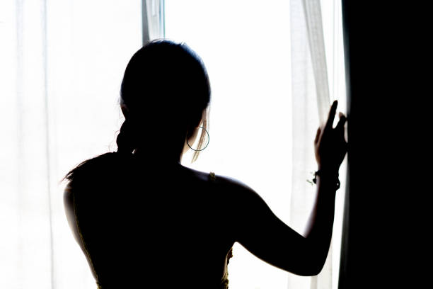 Silhouette woman looking view at the morning stock photo