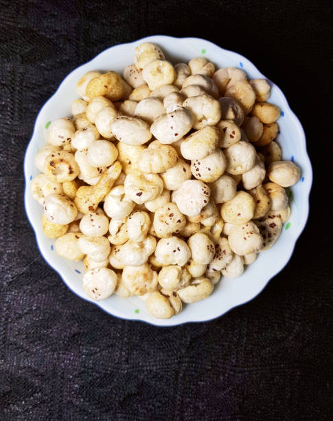 istock Fried and spicy makhana or lotus seeds 1136715281