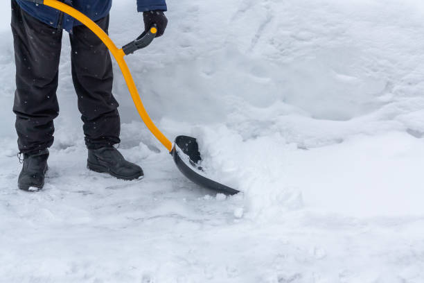 istock A man cleans snow in the yard with a shovel after a heavy snowfall 1136717243