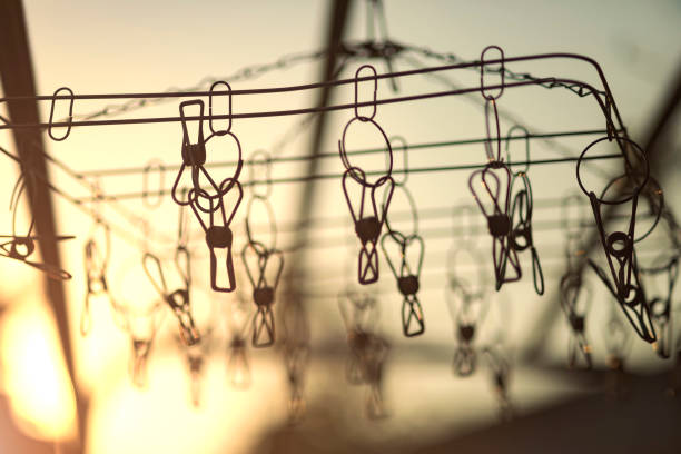 istock clothespins hanging on a clothesline : abstract background 1136721531