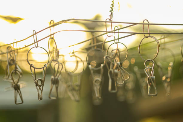 istock clothespins hanging on a clothesline : abstract background 1136721647