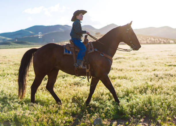 istock Cowboy kid Horseback Riding 1136726053