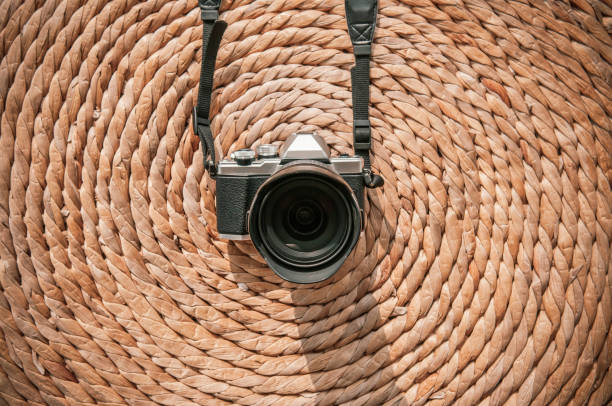 istock Front view old vintage retro style camera on dried water hyacinth mat 1136726087