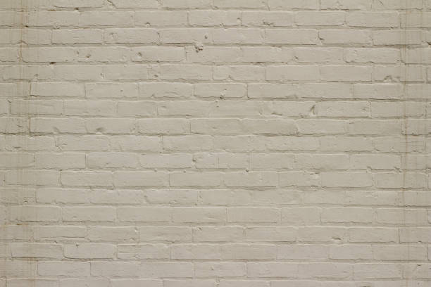 istock Grungy old white painted brick wall abstract background 1136727031