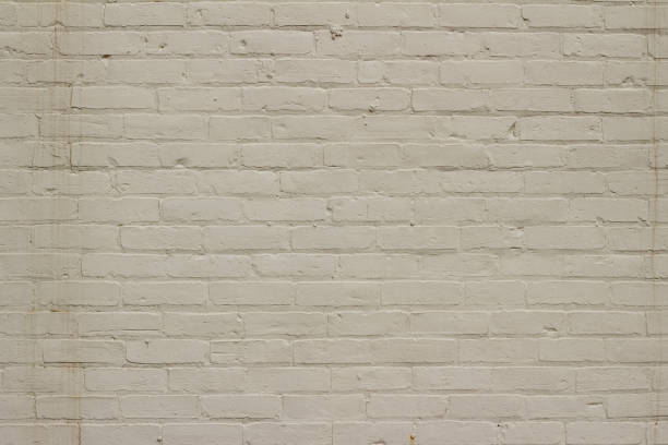 istock Grungy old white painted brick wall abstract background 1136727141