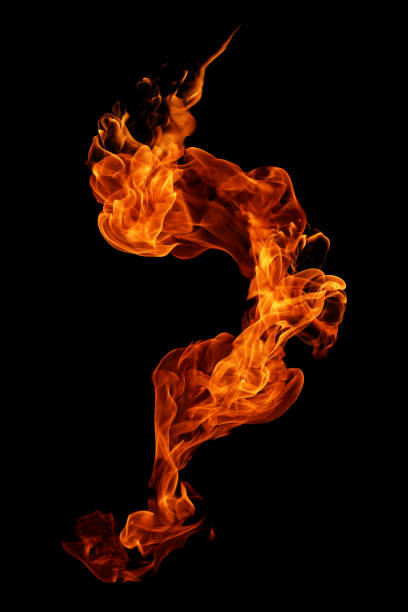 istock movement of fire flames isolated on black background. 1136735275