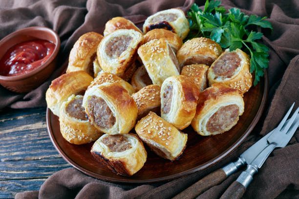 istock sausage rolls on a plate, close up 1136745797