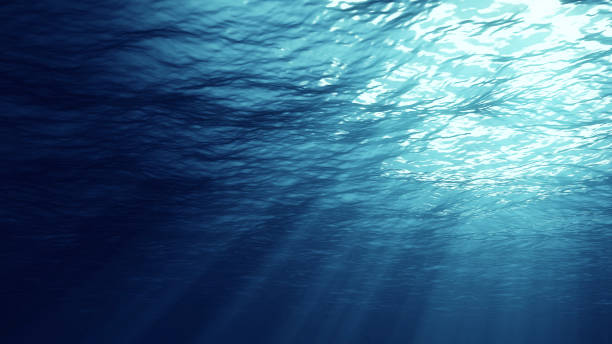 istock 3D rendering of underwater light creates a beautiful solar curtain. Underwater ocean waves oscillate and flow with the rays of light 1136746633