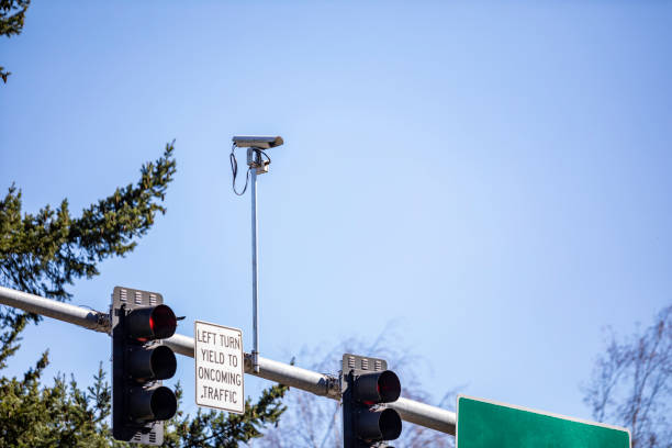 Intersection Traffic Camera Camera at an intersection to watch traffic blue yellow lights stock pictures, royalty-free photos & images