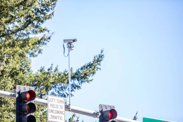 Intersection Traffic Camera Camera at an intersection to watch traffic blue yellow lights stock pictures, royalty-free photos & images