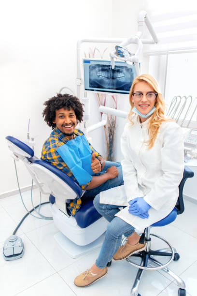 istock Man giving thumbs up at dentist office 1136750363