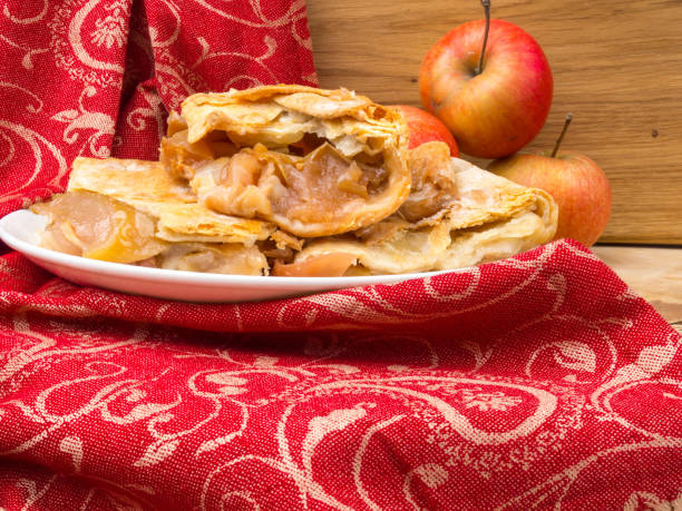 istock Slices of mouth watering rustic apple pie 1136750978