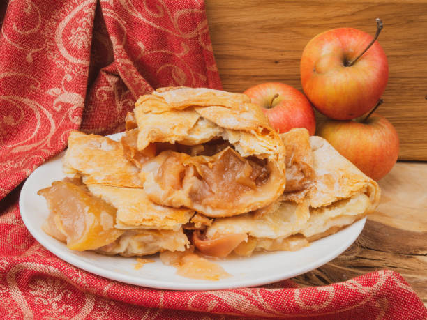 istock Slices of mouth watering rustic apple pie 1136750989