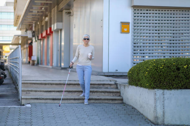 istock Beautiful blind mature woman on street 1136752995