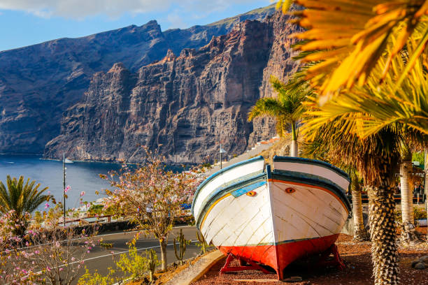 istock Beautiful colored boat near beach 1136755387