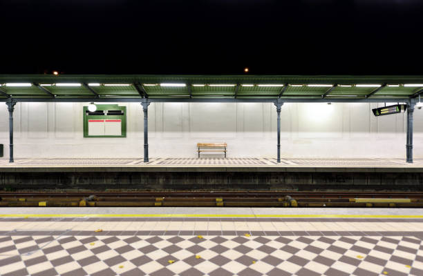 Front view of the outdoor subway platform at night, Europe.